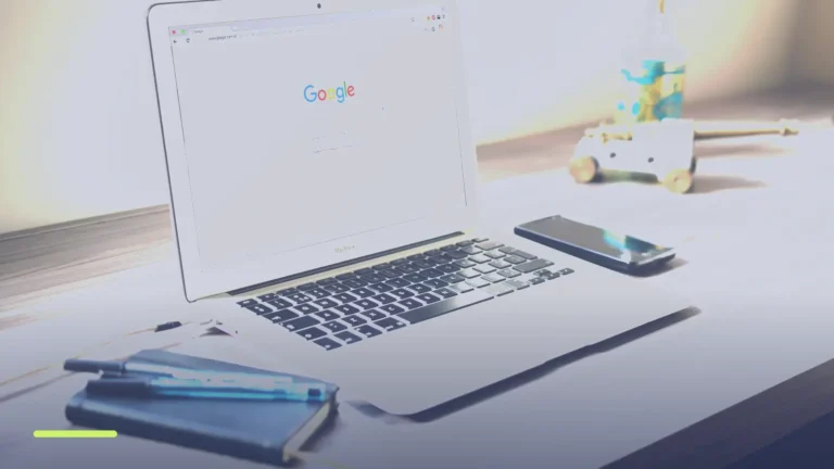 Laptop on a desk showing a Google search page, used to check whether ads are running