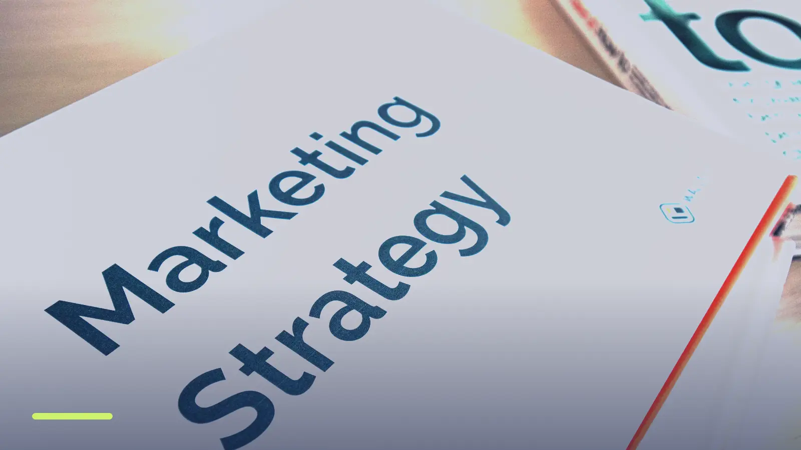 Marketing strategy documents on a desk, representing how to structure ads and ad groups in Google Ads
