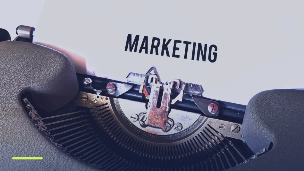 Typewriter with the word Marketing on the page, representing writing Google Ads ad copy
