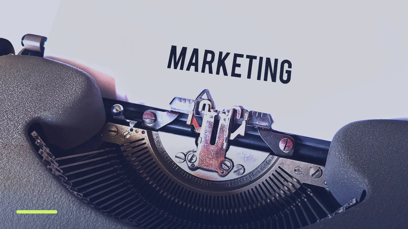 Typewriter with the word Marketing on the page, representing writing Google Ads ad copy