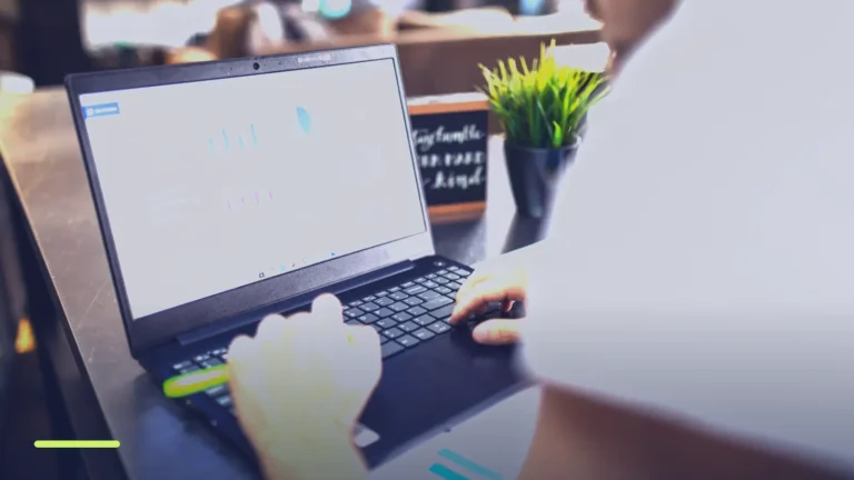 Marketer reviewing campaign charts on a laptop, checking Google Ads Quality Score